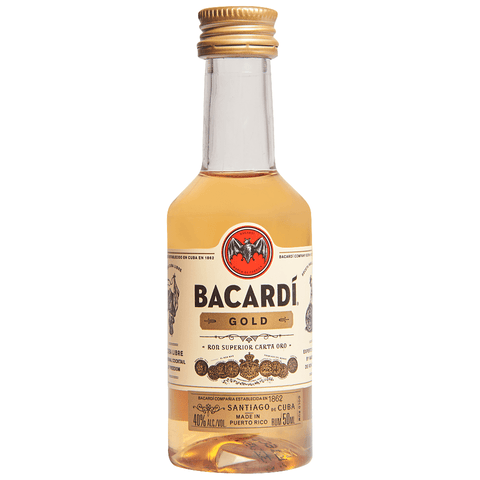 Front view of Bacardi Gold Rum in a clear bottle with a cork stopper.