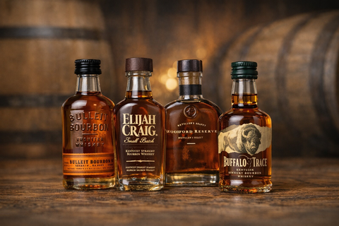 Bourbon sampler kit with amber bottles and wooden barrels in the background