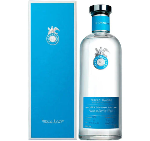 Casa Dragones Tequila bottle with blue label and cork top on a white background
