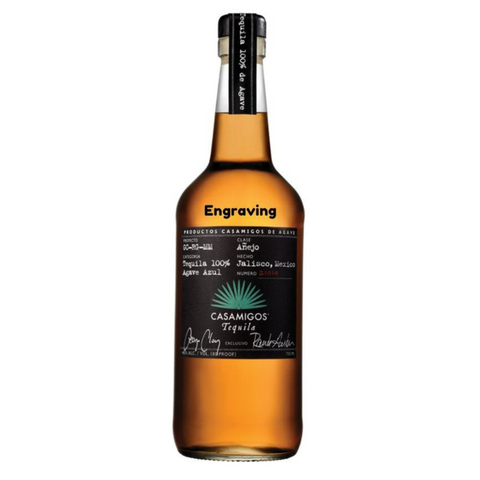 Front view of the Casamigos Anejo bottle with engraved label and green logo.