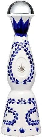 Front view of the Clase Azul Reposado Tequila in a tall, decorative blue and white ceramic decanter.