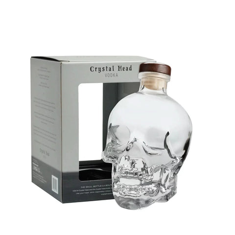 Front view of the crystal skull vodka bottle with wooden cork and box packaging