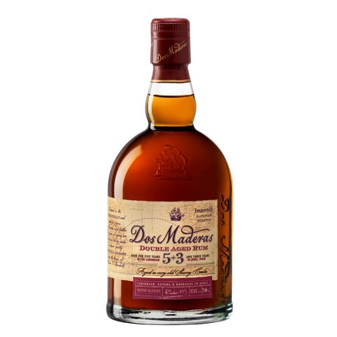 Front view of the brown and gold bottle of Dos Maderas Double Aged Rum with a cork top.