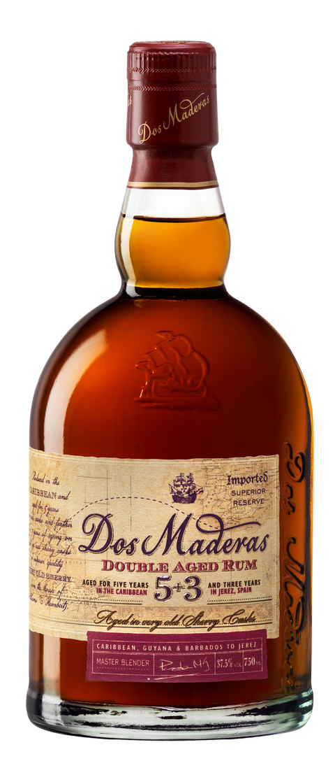 Side view of the brown and gold bottle of Dos Maderas Double Aged Rum with a cork top.
