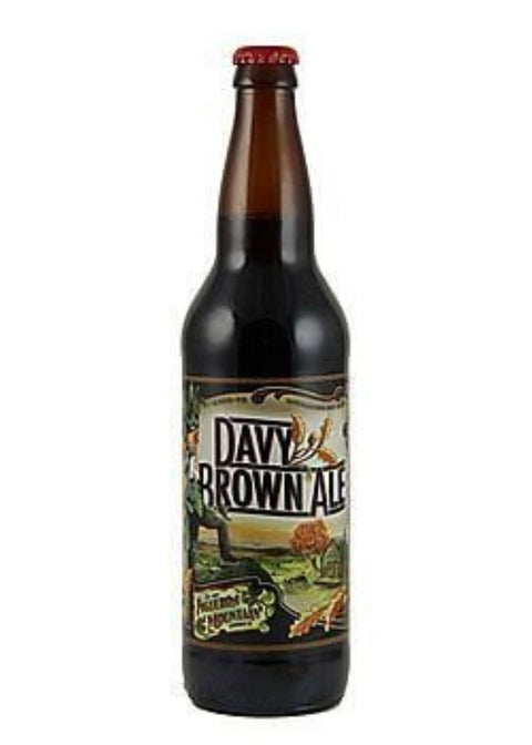 Front view of the brown beer bottle with a label design on a white background