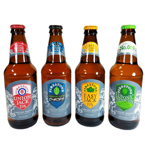 Front view of amber beer bottles with colorful labels on a white background
