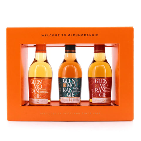 Glenmorangie whiskey taster pack featuring three bottles with a transparent window, orange and red colors.