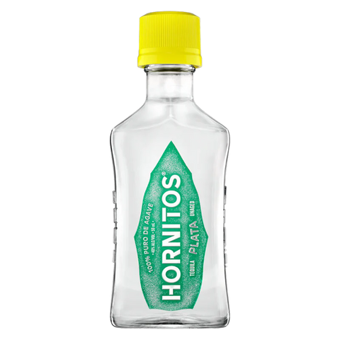 Front view of the clear tequila bottle with a yellow cap and green label