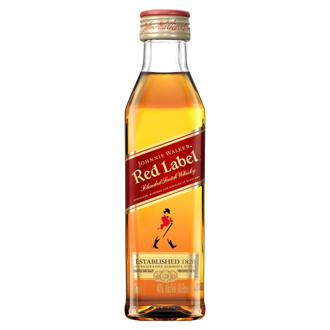 Front view of the transparent bottle of Johnnie Walker Red Label whisky with gold cap.