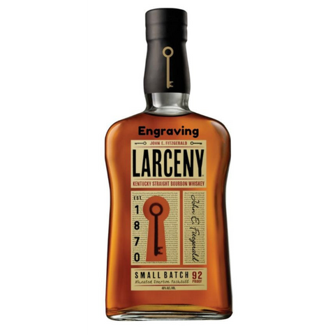 Larceny Bourbon bottle with engraved label and amber color, front view.