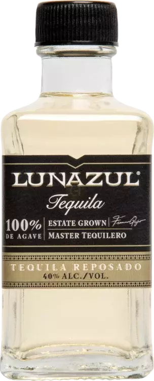 Detail close-up of the clear tequila bottle with gold accents and label