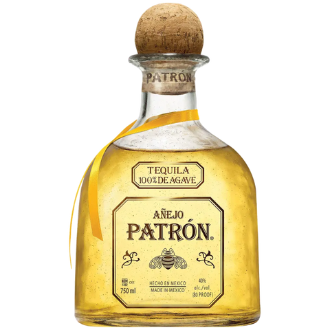 Patrón Añejo tequila in a rounded bottle with a cork stopper, gold and brown colors.