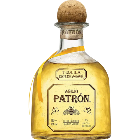 Patrón Añejo tequila in a rounded bottle with a cork stopper, gold and brown colors.