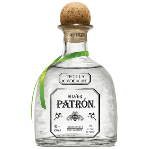 Detail close-up of the clear Patrón Silver bottle with cork stopper and green ribbon.