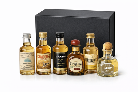 Reposado tequila sampler set in a sleek black gift box with six bottles.