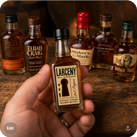 bourbon sampler mini bottle (Larceny) held in hand to show true 50ml size — scale shot