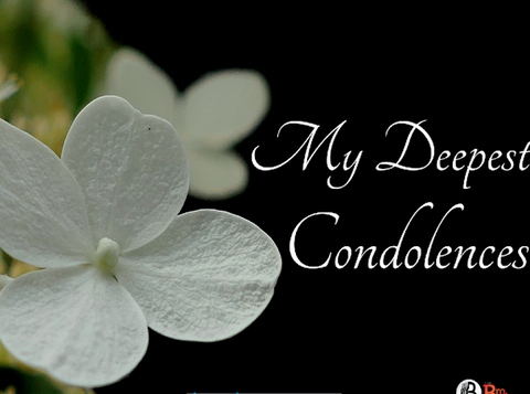 Condolence card with elegant text and white flowers on a black background