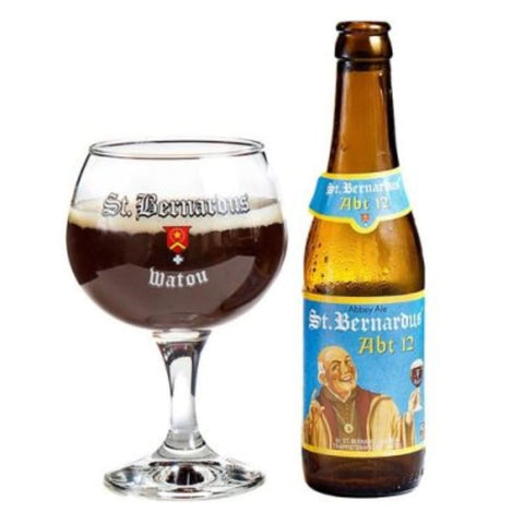 Lifestyle shot of St. Bernardus ABT 12 beer bottle and glass with brown and gold colors.