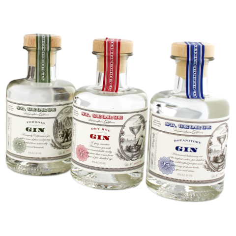 Front view of St George Gin Variety bottles with colorful labels on a white background