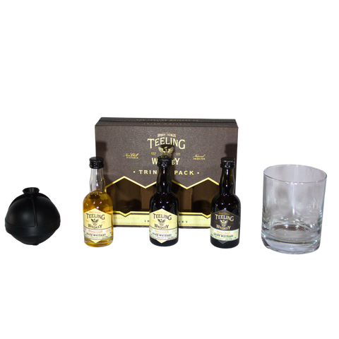 Teeling Irish Whiskey Taster Set featuring three whiskey bottles and a glass tumbler, packaging view.