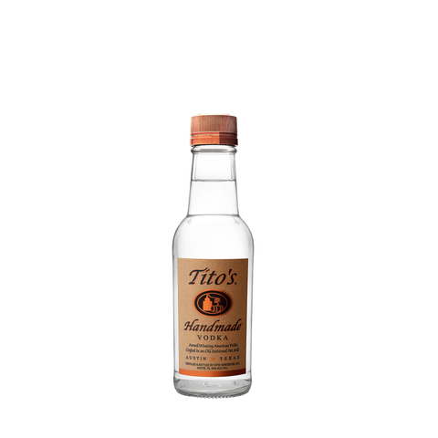 Front view of Tito's Handmade Vodka in a clear glass bottle with an orange cap.