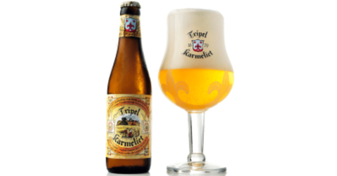 Lifestyle shot of the Triple Karmeliet Belgian Blonde ale in a glass with foam.