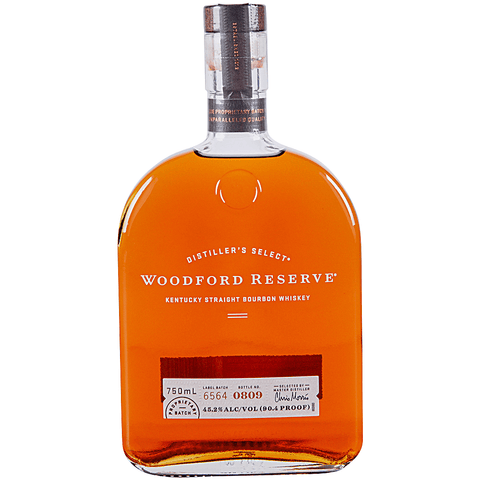 Woodford Reserve bourbon in a clear bottle with detailed label, front view.
