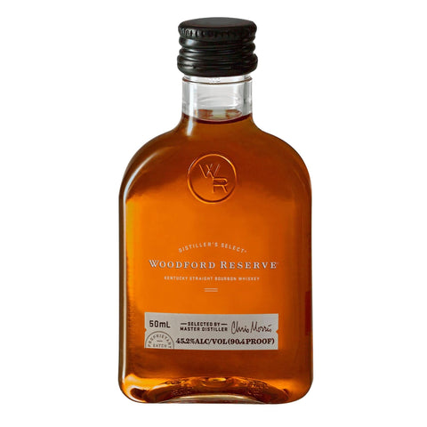 Front view of a glass bottle of Woodford Reserve Kentucky Bourbon with a black label.